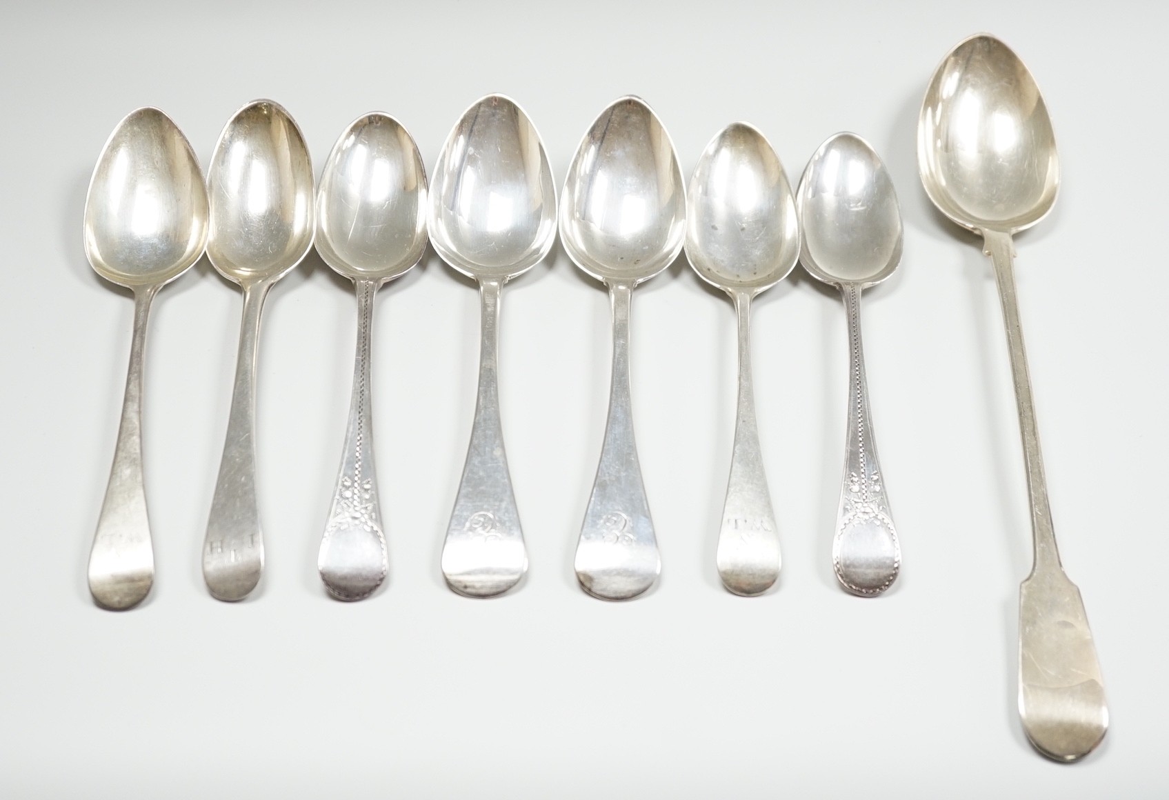 A George III silver fiddle pattern basting spoon, London, 1804 and seven other items of mainly 19th century silver flatware, 18.6oz.